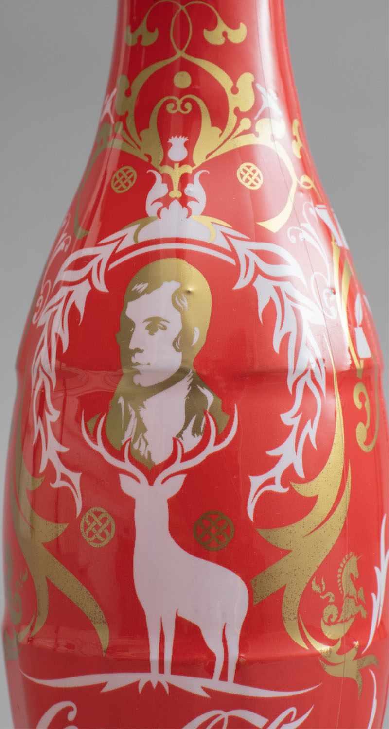 Detail of Coca Cola bottle with Robert Burns portrait