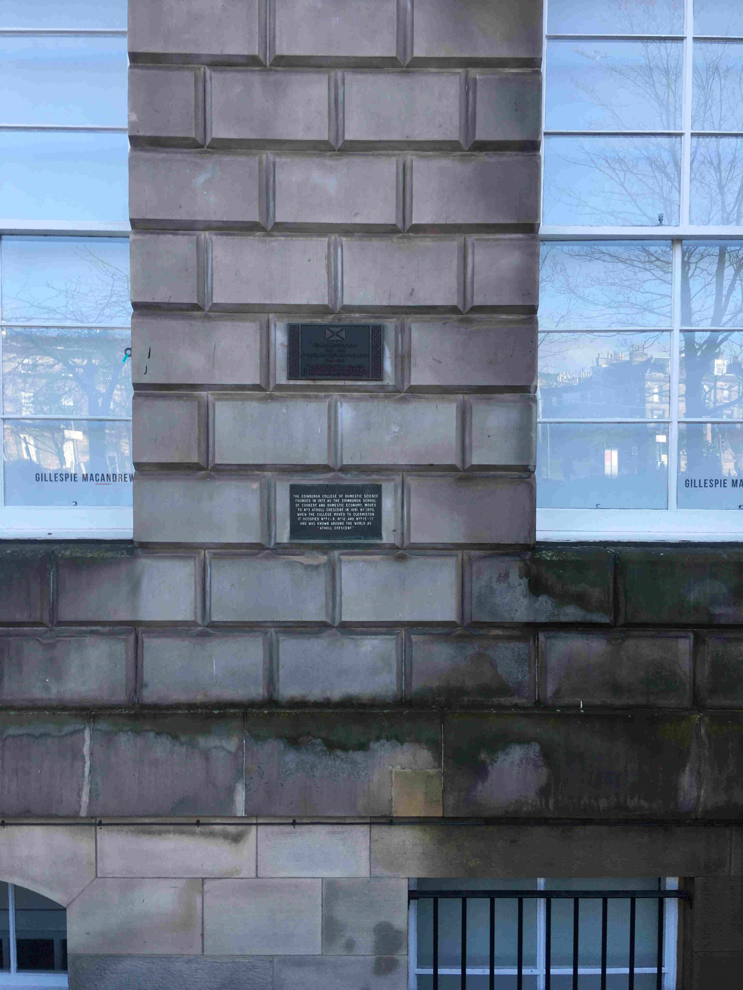 Street view of the frontage of Atholl Crescent, with commemorative plaques visible