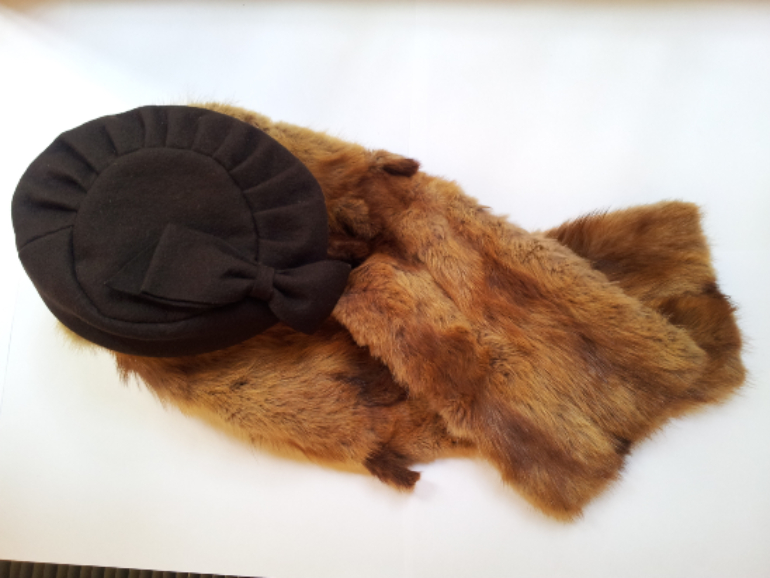 Fur stole and dark brown fabric hat with large bow