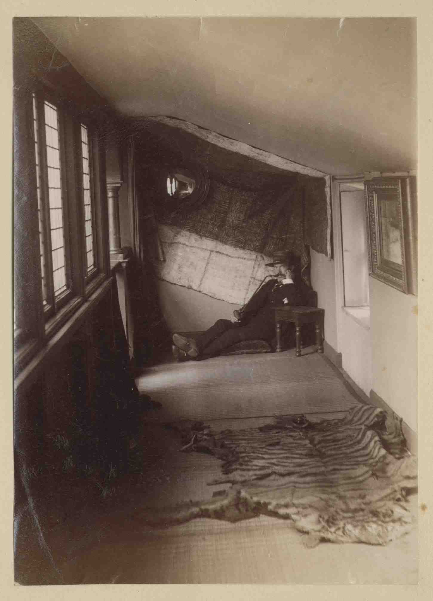 Lauriston photograph album – artist’s studio with man  seated in the corner of an attic