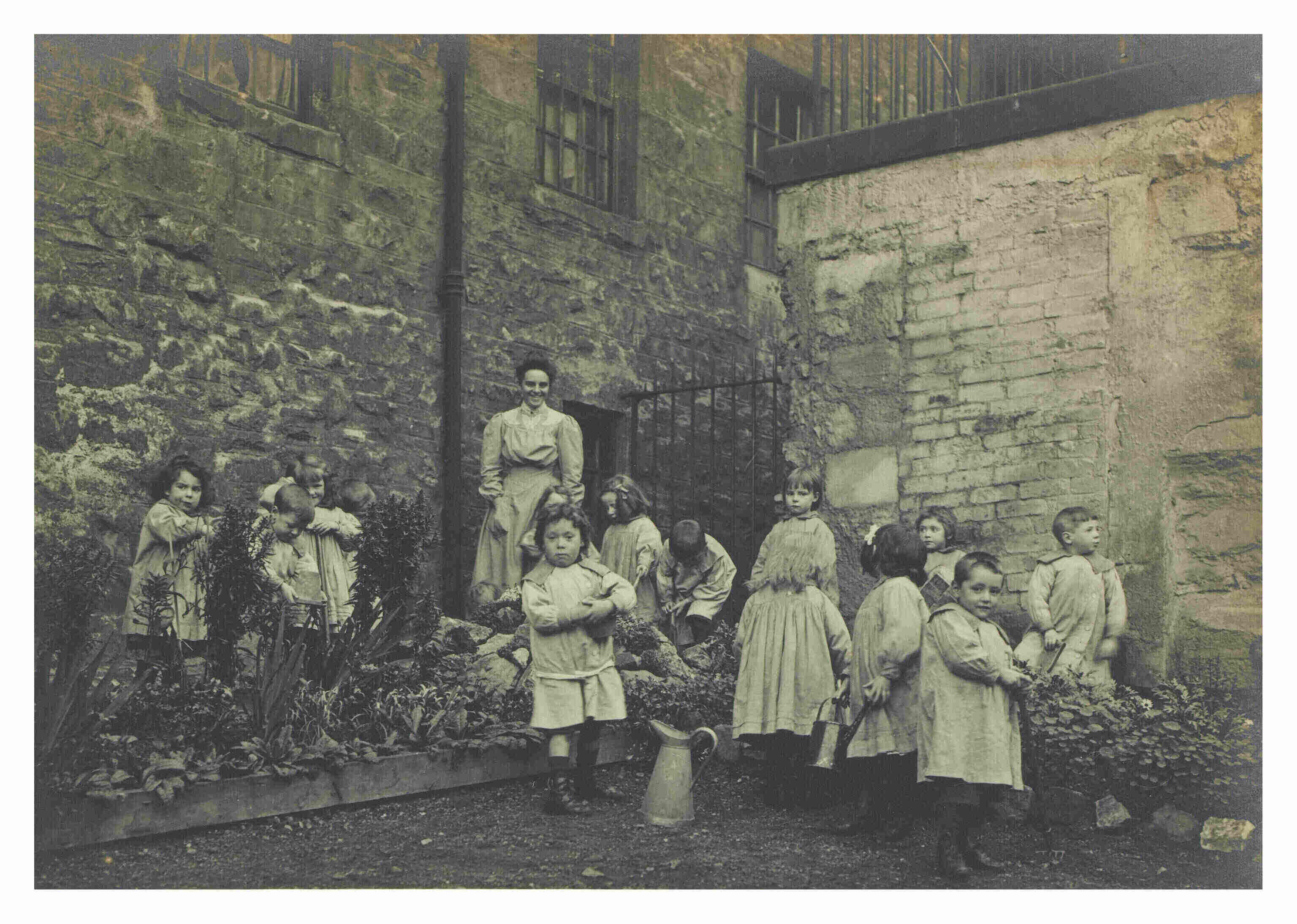 Lileen Hardy & children gardening at St Saviour's Child Garden