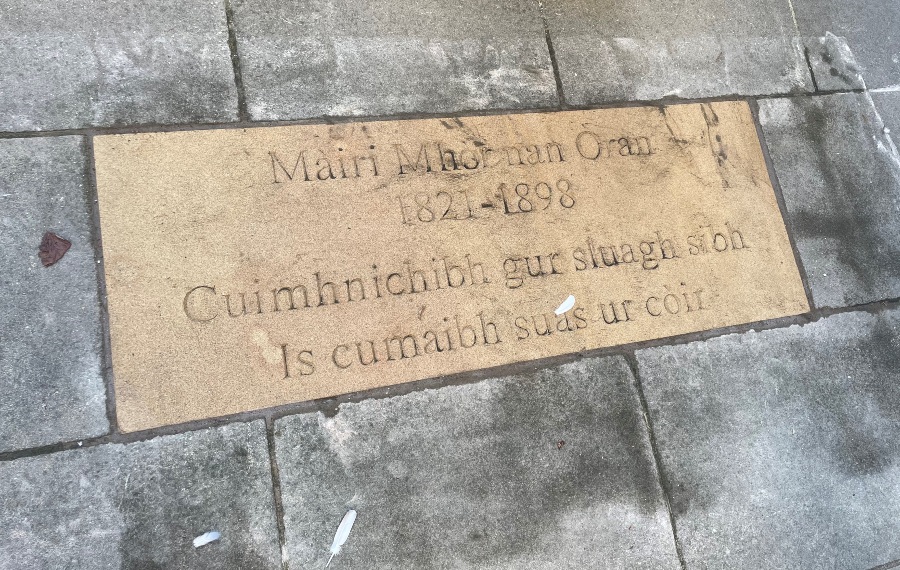 Flag stone in Makars Court with text to celebrate Màiri Mhòr nan Òran