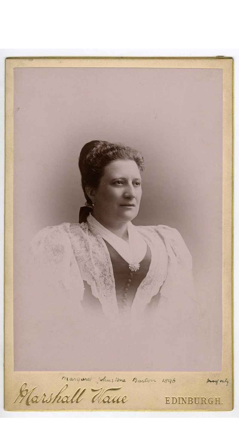 A  sepia photograph on card of a head and shoulders portrait of a woman. At the bottom of the card is the photographer's name, Marshall Wane