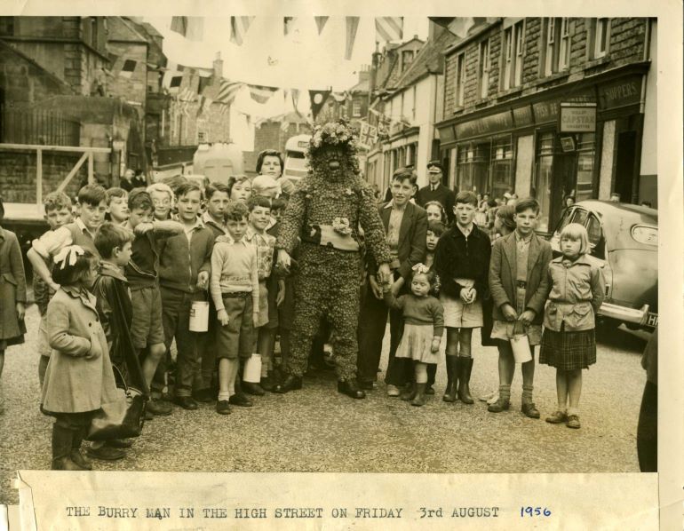 The Burryman surrounded by children, 1956