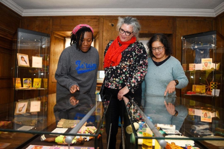 Three members of the Edinburgh Caribbean Association admire an exhibition at the Museum of Edinburgh