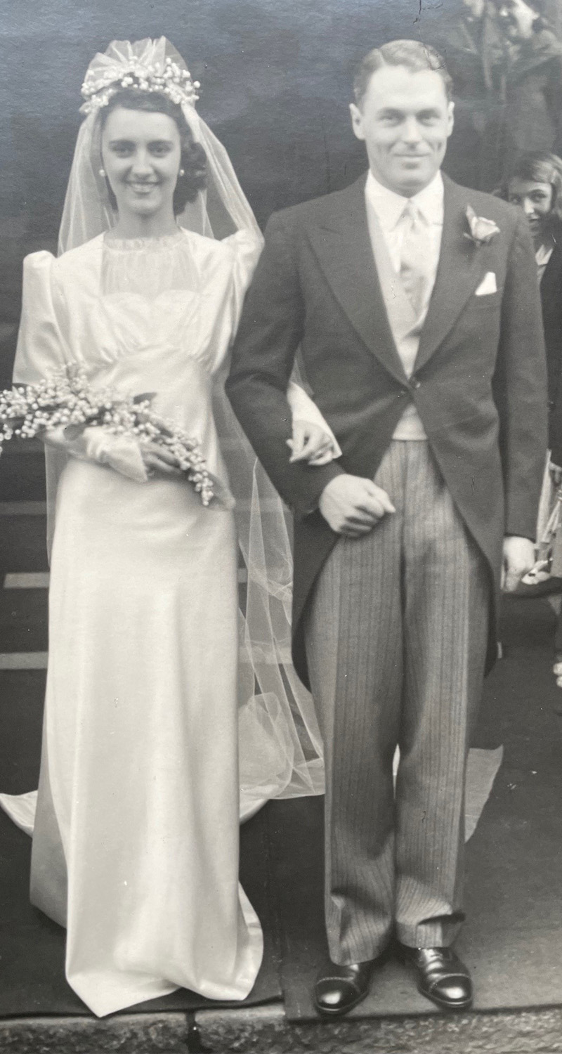 Thereza and Ronald on their wedding day in white dress and dress suit