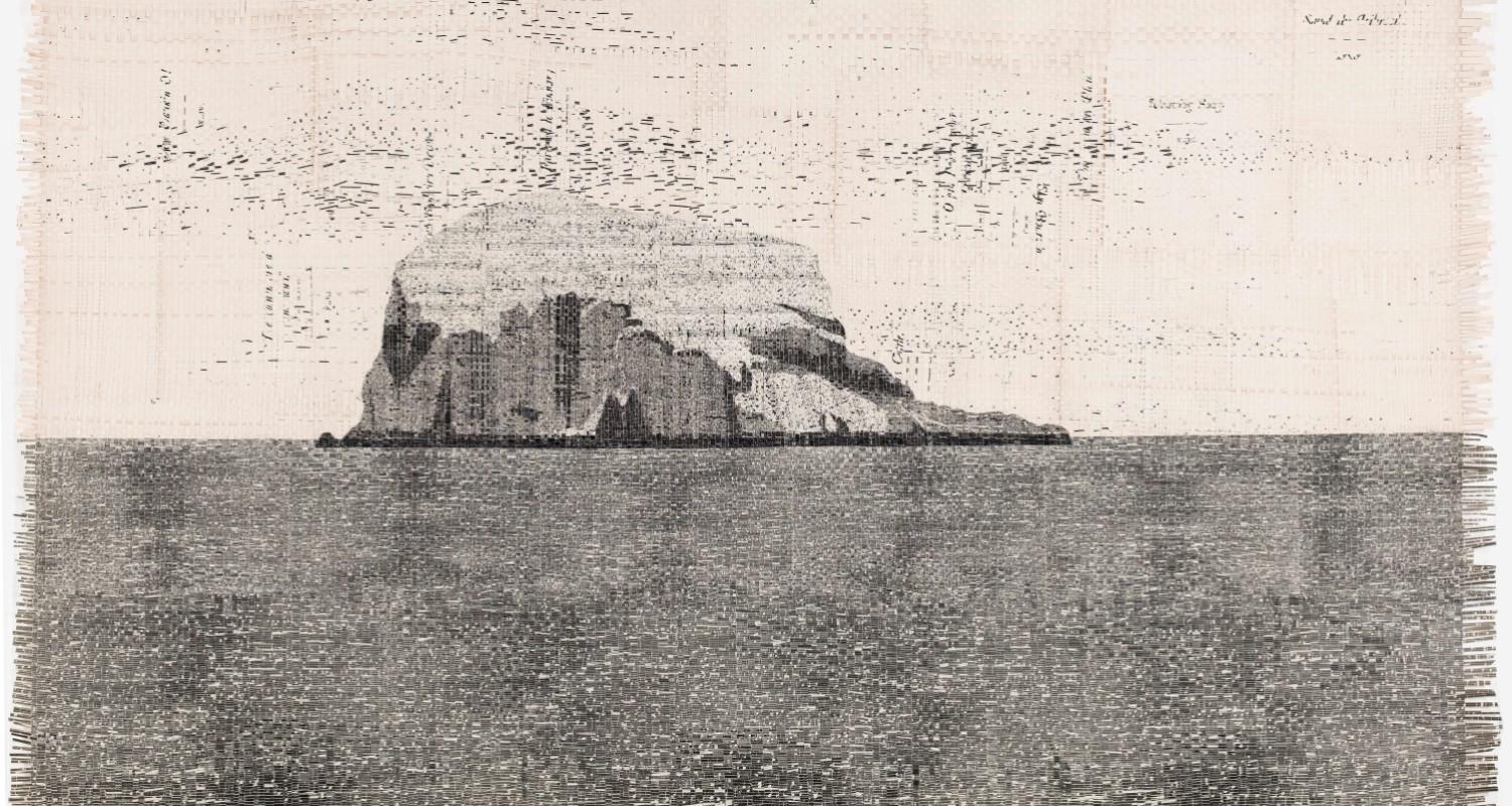 A black and white image of Bass Rock