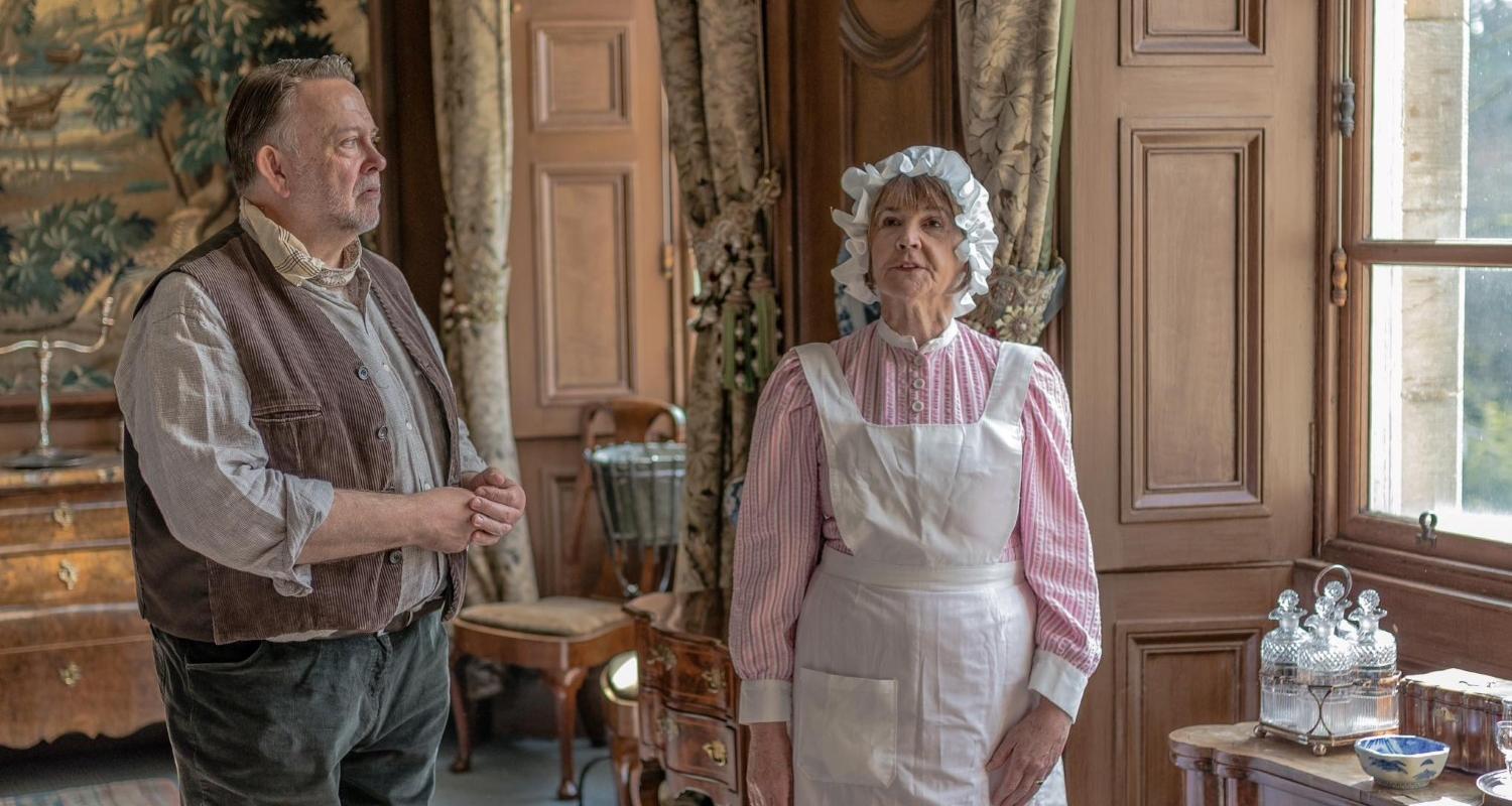 Costumed performers in a historical country house setting