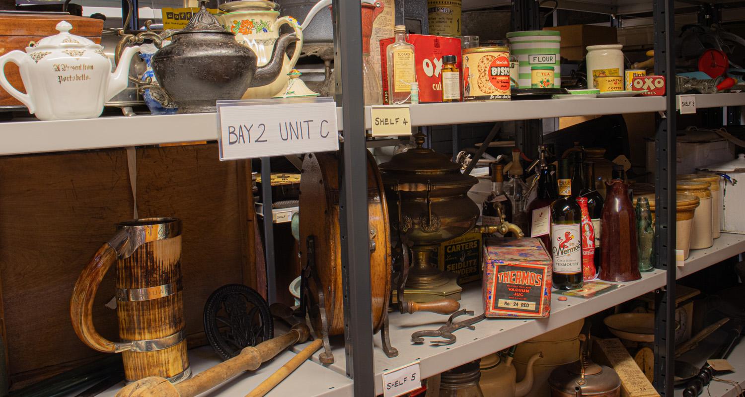 Domestic kitchen and food storage items on shelving at the Collections Centre store