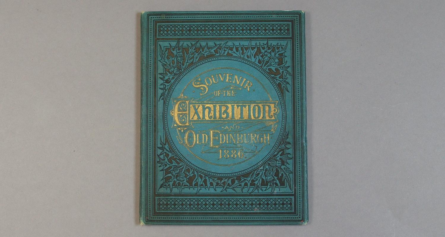 The cover of a blue and gilt book titled "Souvenir of the Exhibition Old Edinburgh 1886"
