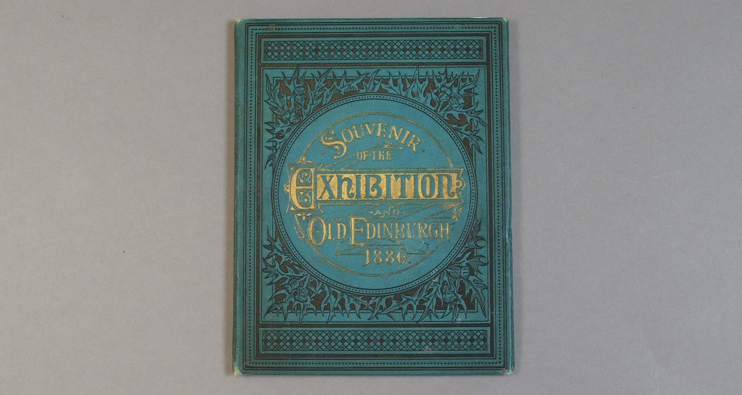 The cover of a blue and gilt book titled "Souvenir of the Exhibition Old Edinburgh 1886"