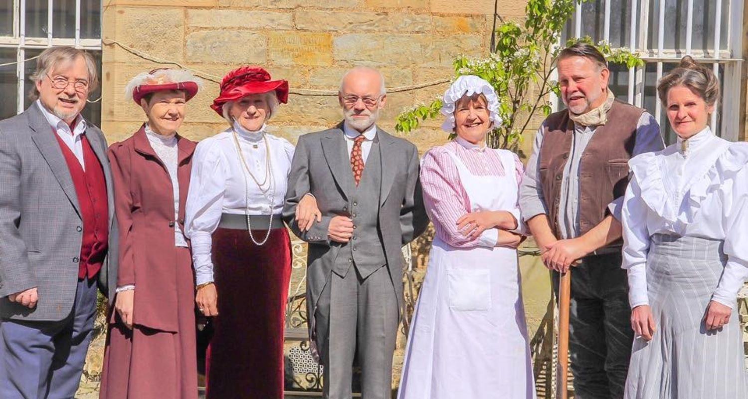 7 members of the Edinburgh Living History group dressed in Edwardian dress 