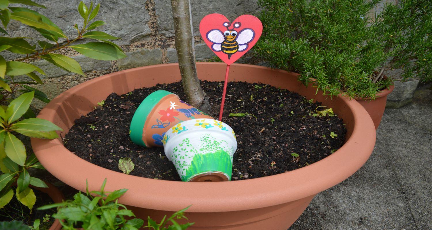 Painted pots in a garden