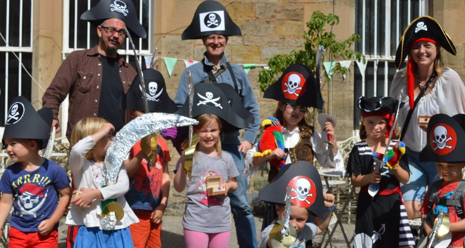 A group of adults and children dressed up as pirates