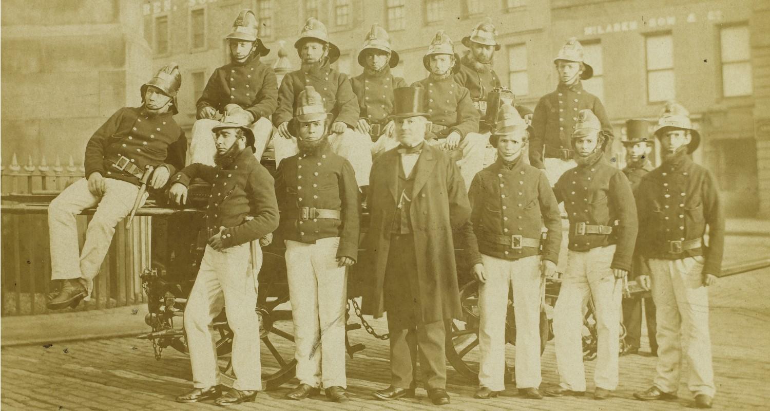 A sepia photograph of a group of firemen
