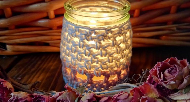 Photo of a class bottle covered in crochet