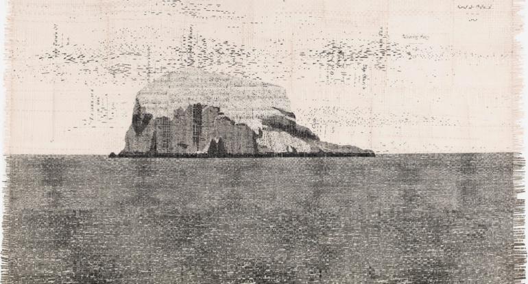 A black and white image of Bass Rock