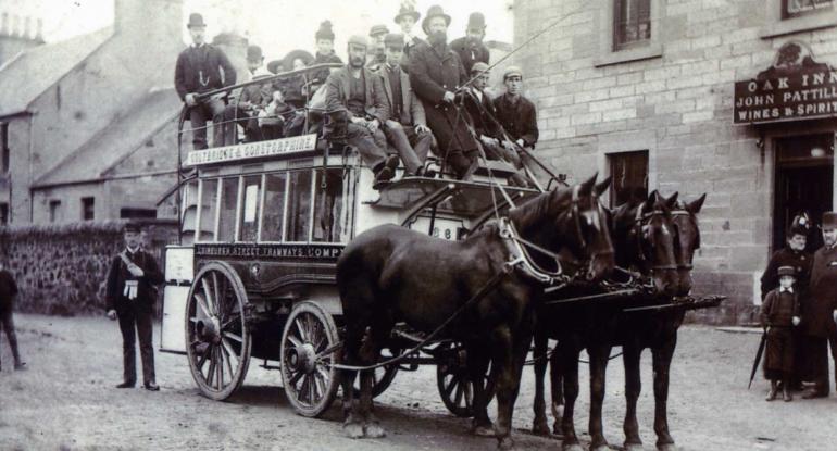 A horse bus with three horses full of passengers outside the Oak Inn, Corstorphine, c1890