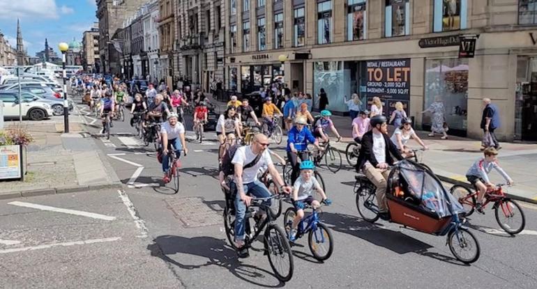 Critical Mass group of cyclists in George St 30 July 2022