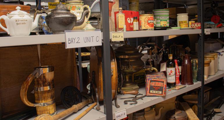 Domestic kitchen and food storage items on shelving at the Collections Centre store Domestic kitchen and food storage items on shelving at the Collections Centre store