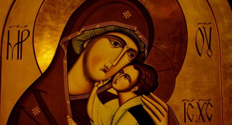 Introduction to Iconography A gold-coloured image of Mary in a red and gold shawl cradling the baby Jesus