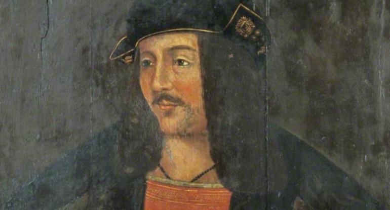 Head and shoulders portrait of James IV in an orange tunic and wearing a black and gold hat