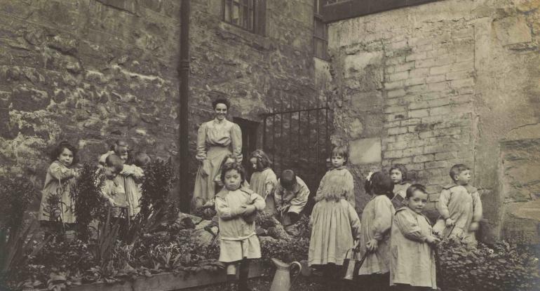 Lileen Hardy & children gardening at St Saviour's Child Garden