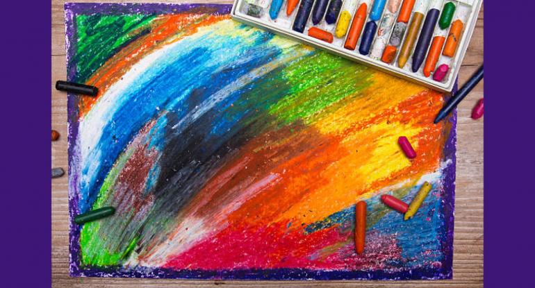 A drawing of multicoloured crayons with purple glitter around the edges of the paper