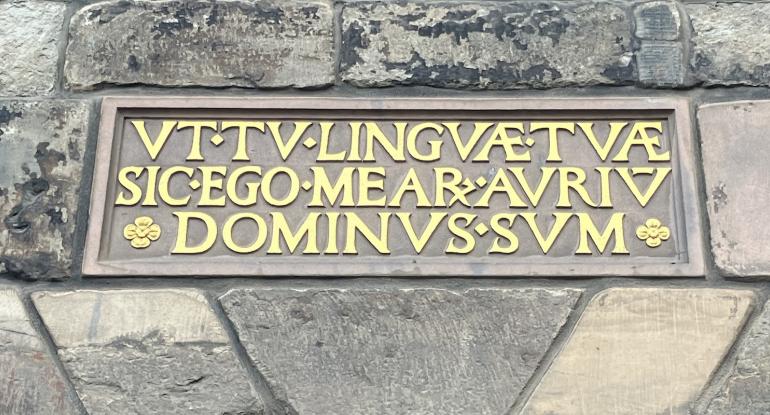 Plaque on Museum of Edinburgh:  'UT TU LINGUAE TUAE SIC EGO ME AR AURIU DOMINUS SUM', which means 'As thou art (master) of my tongue, so I am master of my ears'.  
