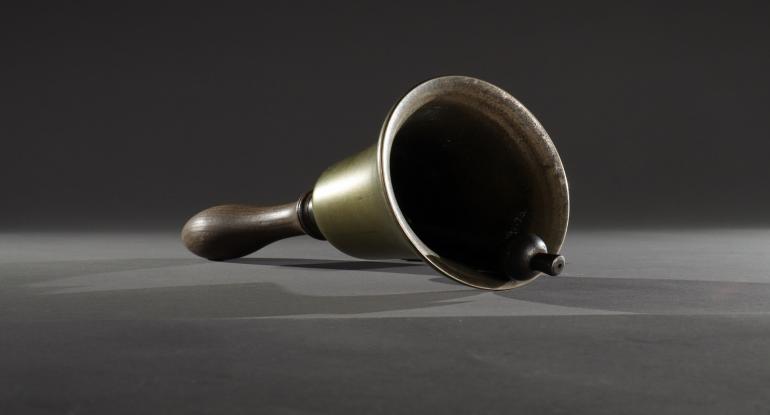 Metal bell with wooden handle