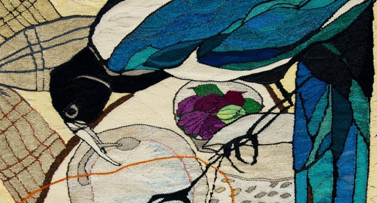 Close up of tapestry showing an exotic bird