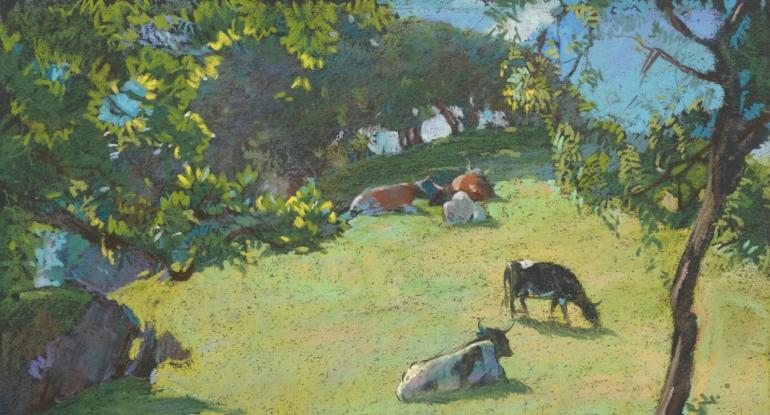 Trees and cattle lying on on the grass