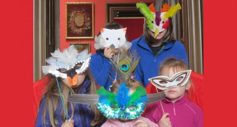 Children in Lauriston Castle wearing Carnival masks of cats and birds