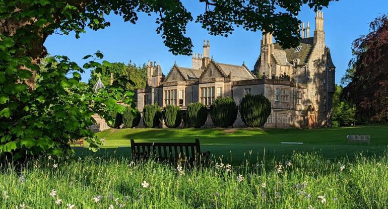 Photo of Lauriston Castle Edinburgh looking through grasses and trees