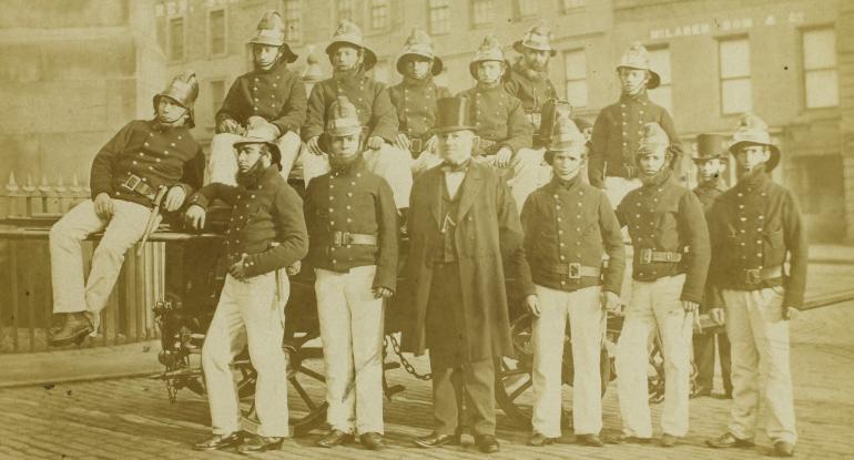 A sepia photograph of a group of firemen