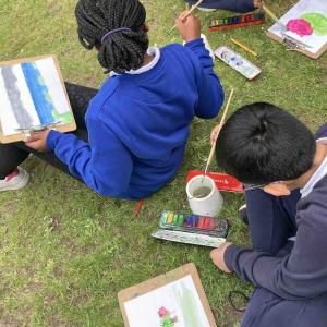 Pupils taking part in an outdoor painting workshop at Lauriston Castle