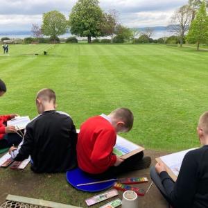 Children painting outdoors