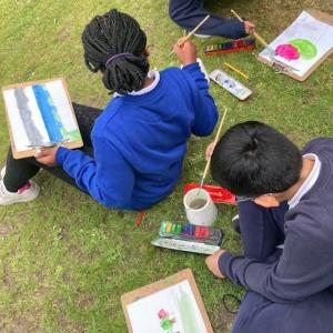 Children painting outdoors