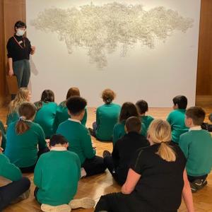 Pupils discussing an artwork by Fiona Hutchison