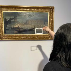 Pupil using a viewfinder to look at 'La Music Veneziana', 1909 by Charles Hodge Mackie