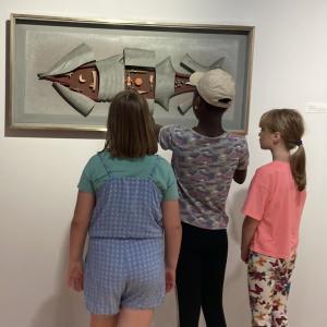 Children engaging with the City Art Centre exhibition 'Will Maclean: Points of Departure', 2022