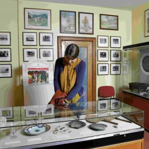 A visitor enjoys the displays at The Writers' Museum. Image (c) Museums & Galleries Edinburgh 