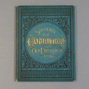 A blue and gold book titled "Souvenir of the Exhibition and Old Edinburgh 1886"