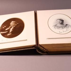 Open book showing two pages, each with an oval portrait photograph of a member of the British Women's Temperance Association.