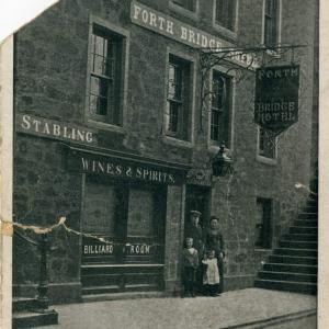 What was the Forth Bridge Hotel is where the popular pub The Ferry Tap is now on Queensferry High Street. While the exterior has changed a little, the steps on either side give away the location. © CEC Museums & Galleries Edinburgh, Queensferry Museum