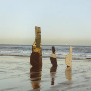 Robert Callender, works including 'Stray Fifie Rudder', 1984 and 'Cracked Rudder', 1984, on the beach at Kinghorn, 1990s. Courtesy of the estate of Robert Callender. Photography Robert Callender