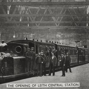 A postcard with the title "The opening of Leith Central Station" showing workers standing on the platform next to a steam train.