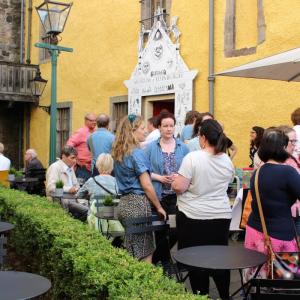 A group of volunteers chatting in the courtyard at the Museum of Edinburgh