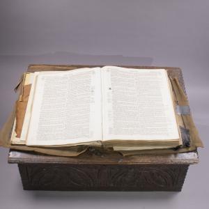 Open bible on wooden "lectern" box.